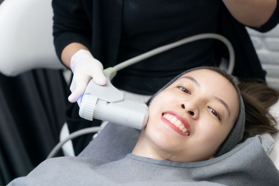 A Smiling Woman undergoing HIFU Facelift