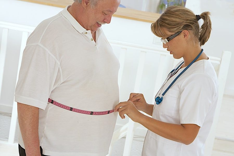 Nurse Measuring Patient's Waist Tape,treatment targeting stubborn fat on abdomen and thighs
