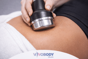 Ultrasound cavitation treatment breaking down fat cells in the abdomen
