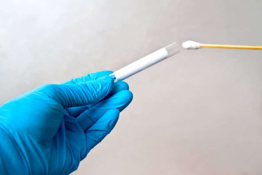 A Swab Sample being Inserted into a Tube