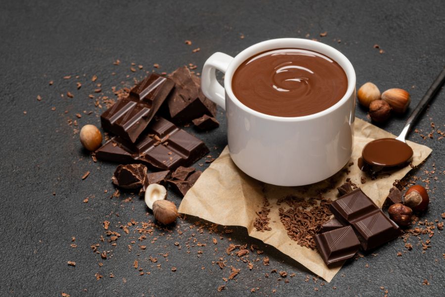 Hot Chocolate Surrounded by Bars of Chocolate