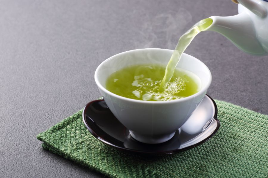Green Tea is Being Poured into a Cup