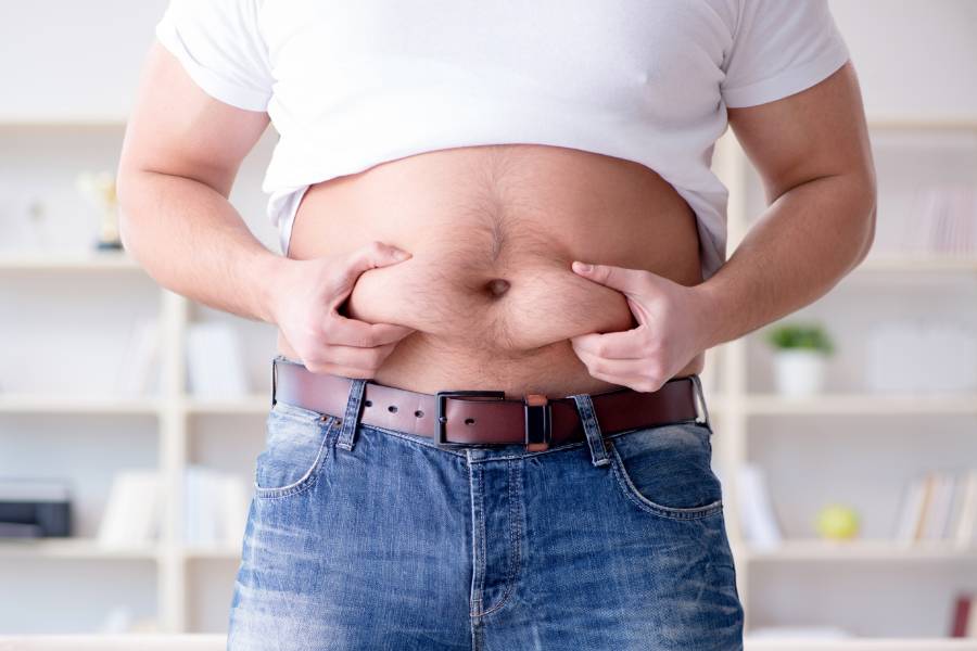 Man Holding The Fat of His Tummy