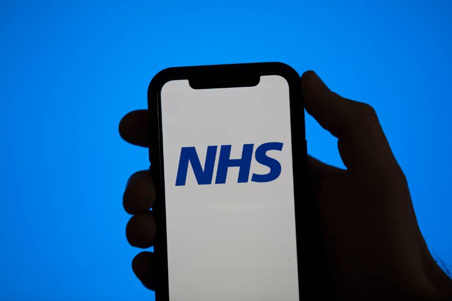 Smartphone Displaying the NHS Logo