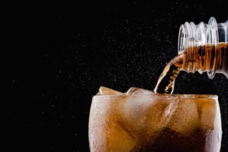 A Cola Drink being Poured into a Glass