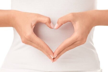 Woman's Hands forming a Shape to Signify a Healthy Heart