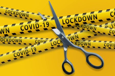 Cutting Yellow Tapes Labelled 'Covid-19 Lockdown'