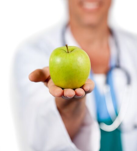 Doctor Holding Green Apple His Hand