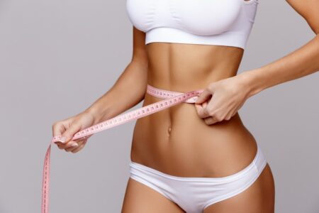 Woman White Bra Top Holding Measuring Tape, Non-surgical beauty treatments